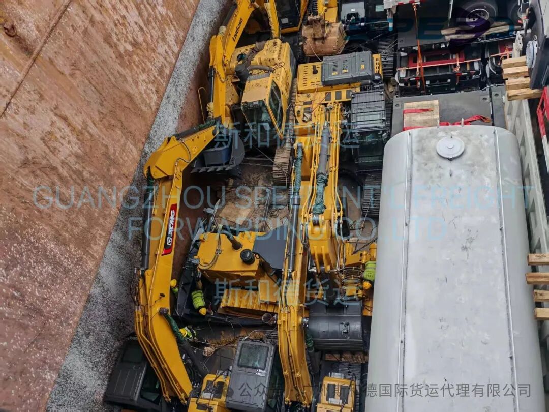 Expert stowage: Heavy excavators securely positioned in the vessel's hold